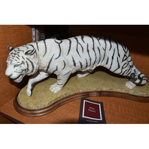 683 - A BOXED FRANKLIN MINT HAND PAINTED PORCELAIN SCULPTURE, 'White Majesty' a depiction of a White Benga... 