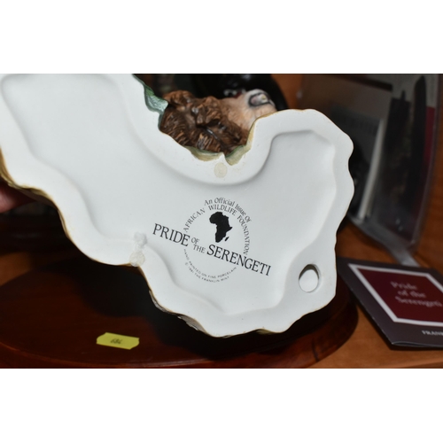 684 - THREE FRANKLIN MINT PORCELAIN SCULPTURES OF BIG CATS, comprising 'Pride of the Serengeti' a sculptur... 