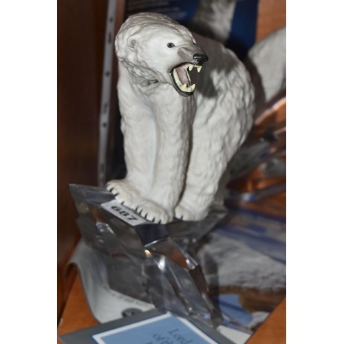 687 - TWO D.J. SHINN SCULPTURES FOR FRANKLIN MINT, comprising 'Lord of the Ice' a Polar Bear standing on a... 