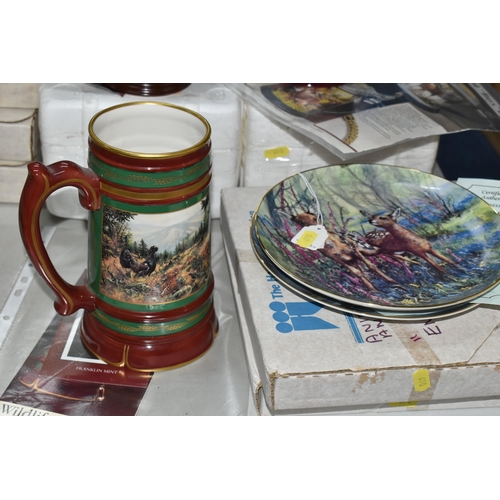 690 - A COLLECTION OF BOXED WILDLIFE THEMED COLLECTORS PLATES AND TANKARDS, to include a set of eight Wedg... 