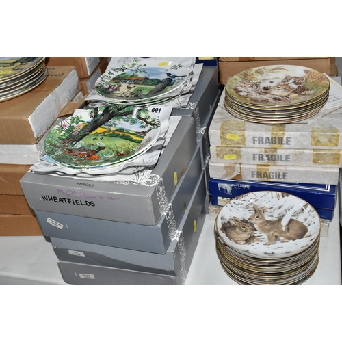 691 - FIFTY FOUR COLLECTORS PLATES, mainly boxed, on the themes of wildlife and pets, series comprising tw... 