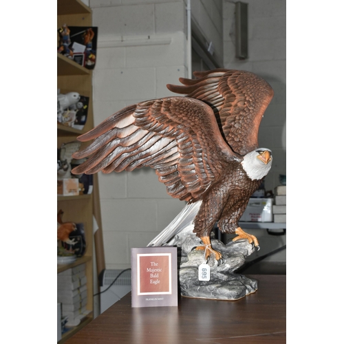 695 - A BOXED FRANKLIN MINT 'THE MAJESTIC BALD EAGLE' FIGURE by Ronald Van Ruyckevelt, depicting a bald ea... 