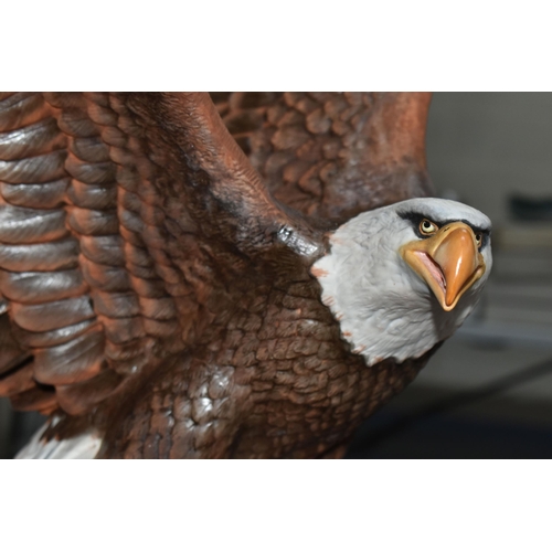 695 - A BOXED FRANKLIN MINT 'THE MAJESTIC BALD EAGLE' FIGURE by Ronald Van Ruyckevelt, depicting a bald ea... 