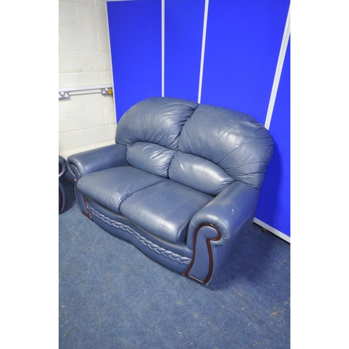 1412 - A BLUE LEATHER FOUR PIECE LOUNGE SUITE, comprising two two seater settee's, armchair and a storage p... 