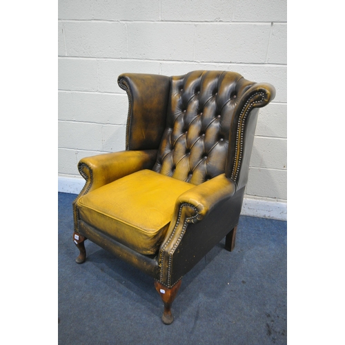 1413 - A MUSTARD YELLOW LEATHER CHESTERFIELD WING BACK ARMCHAIR, on cabriole legs, width 80cm x depth 85cm ... 