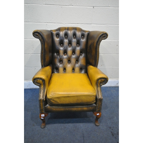 1413 - A MUSTARD YELLOW LEATHER CHESTERFIELD WING BACK ARMCHAIR, on cabriole legs, width 80cm x depth 85cm ... 