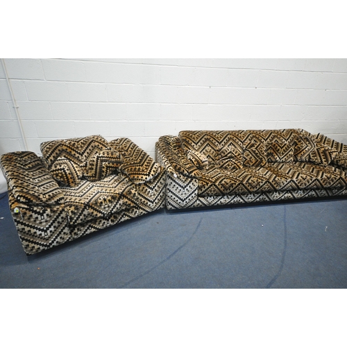 1418 - A HOWARD KEITH 1970'S PATTERNED TWO PIECE SUITE, comprising a four seater settee, label to underside... 