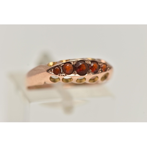 101 - A 9CT GOLD AND GARNET FIVE STONE RING, five circular cut garnets, prong set in yellow gold, hallmark... 