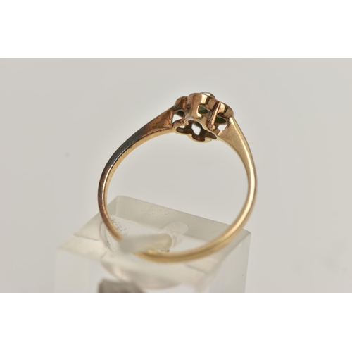 103 - A 9CT GOLD QUATREFOIL EMERALD RING, four circular cut emeralds in a semi bezel setting, accented wit... 