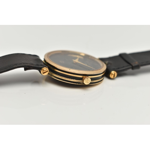 15 - A VINTAGE LADYS GOLD PLATED QUARTZ GUCCI WRISTWATCH, round black dial signed Gucci, case width appro... 