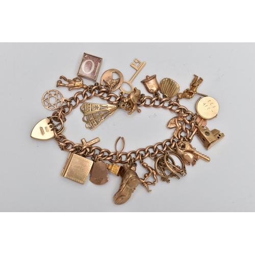 51 - A 9CT GOLD CHARM BRACELET, curb link bracelet, links stamped 9.375, fitted with twenty six charms in... 