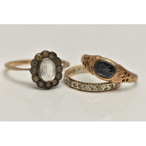 68 - THREE GEM SET RINGS, to include an AF 9ct gold hematite intaglio signet ring, open work detailed sho... 