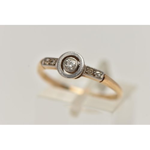 71 - A YELLOW METAL DIAMOND RING, central old cut diamond, collet set in a white metal mount, flanked wit... 