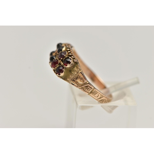 78 - A LATE VICTORIAN 9CT GOLD GARNET RING, designed with two rows of five rose cut garnets, to a texture... 