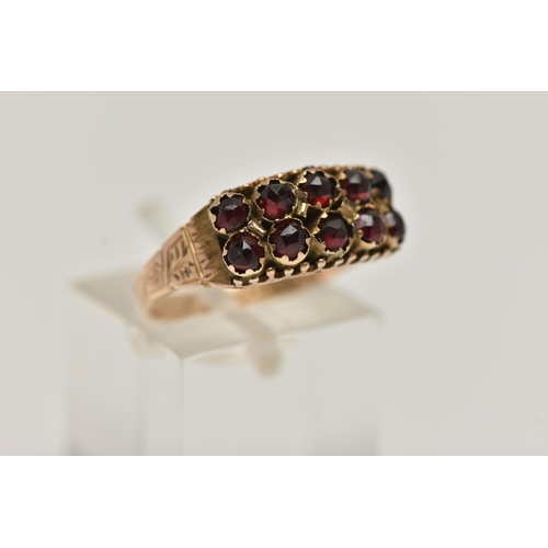 78 - A LATE VICTORIAN 9CT GOLD GARNET RING, designed with two rows of five rose cut garnets, to a texture... 