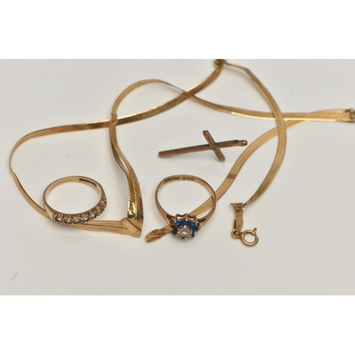 87 - AN ASSORTMENT OF 9CT GOLD JEWELLERY, to include a rose gold cross pendant, two gem set rings and an ... 