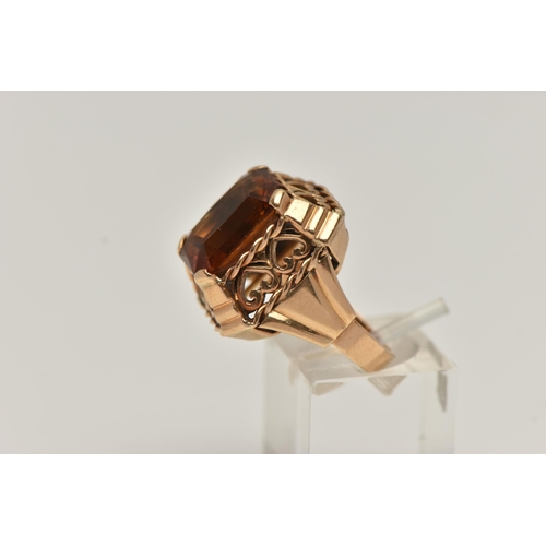 89 - A FRENCH GOLD AND CITRINE RING, rectangular cut deep orange citrine, prong set in yellow gold, a lar... 