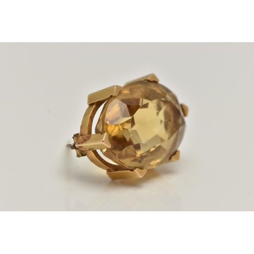 90 - A LATE VICTORIAN 15CT GOLD AND CITRINE BROOCH, oval cut citrine, prong set with six triangular form ... 