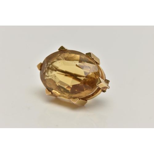 90 - A LATE VICTORIAN 15CT GOLD AND CITRINE BROOCH, oval cut citrine, prong set with six triangular form ... 