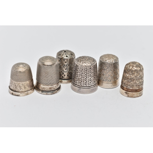 124 - SIX THIMBLES, to include two with full silver hallmarks, approximate gross weight 9.2 grams, two sta... 