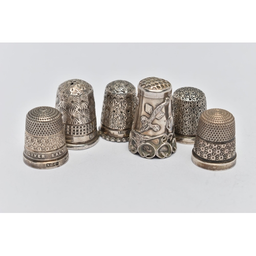 125 - SIX THIMBLES, to include five with full silver hallmarks, approximate gross weight 19.6 grams, one s... 