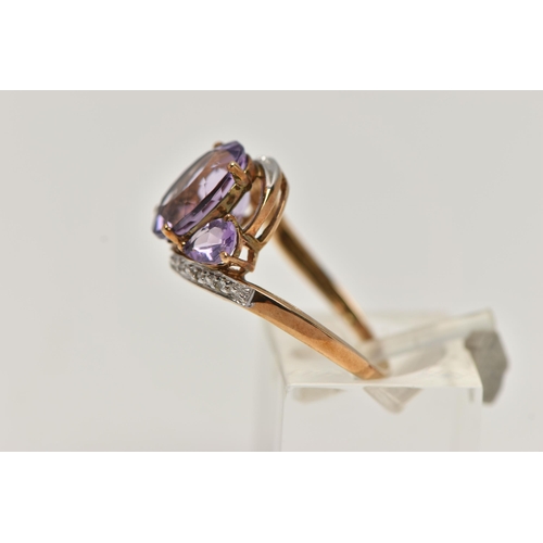 143 - AN AMETHYST AND DIAMOND DRESS RING, principle oval cut amethyst with two additional pear cut amethys... 