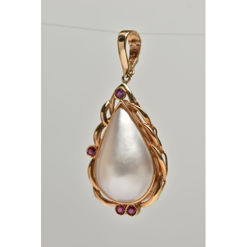 144 - A MABE PEARL AND RUBY PENDANT, a pear Mabe pearl collet set in yellow metal accented with four circu... 