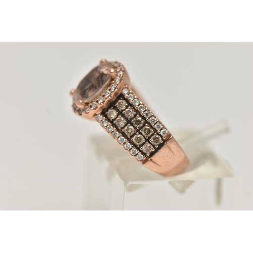 146 - A 14CT GOLD 'LE VIAN' DRESS RING, oval cut morganite, prong set in rose gold with a halo of colourle... 