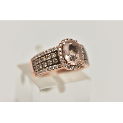 146 - A 14CT GOLD 'LE VIAN' DRESS RING, oval cut morganite, prong set in rose gold with a halo of colourle... 