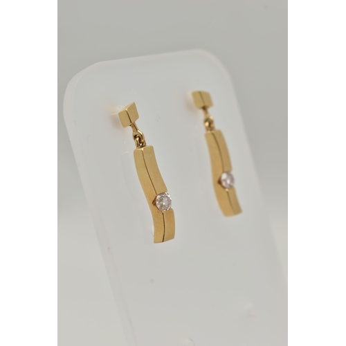 154 - A PAIR OF 18CT GOLD DIAMOND DROP EARRINGS, each of a polished curved bar set with a round brilliant ... 