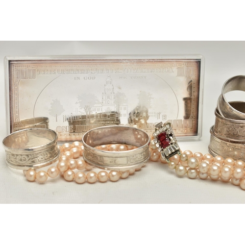 162 - A .999 FINE SILVER ONE HUNDRED DOLLAR BANK NOTE, SILVER NAPKIN RINGS AND A IMITATION PEARL NECKLACE,... 