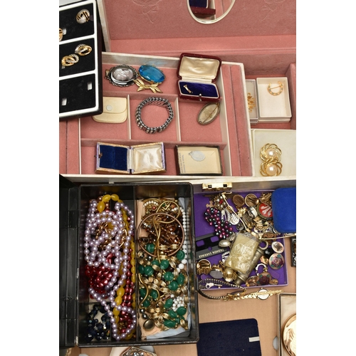 206 - TWO BOXES OF COSTUME JEWELLERY, to include a cream jewellery box, an old First Aid tin box containin... 