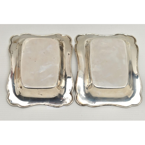 234 - TWO EARLY 20TH CENTURY SILVER BONBON DISHES, each of a rectangular from with wavy edges, hallmarked ... 