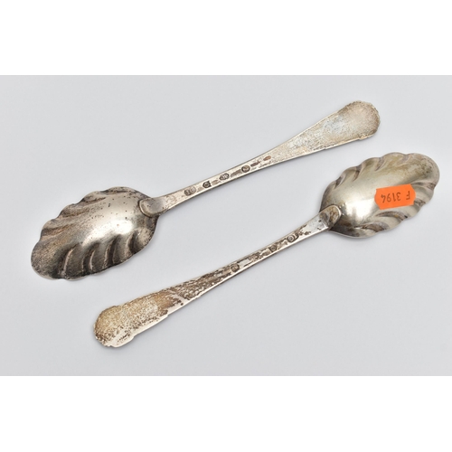 236 - A PAIR OF GEORGE III IRISH SILVER FRUIT SPOONS, worn silver gilt fluted bowls, the handles later cha... 