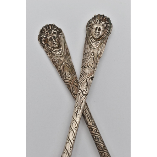 236 - A PAIR OF GEORGE III IRISH SILVER FRUIT SPOONS, worn silver gilt fluted bowls, the handles later cha... 