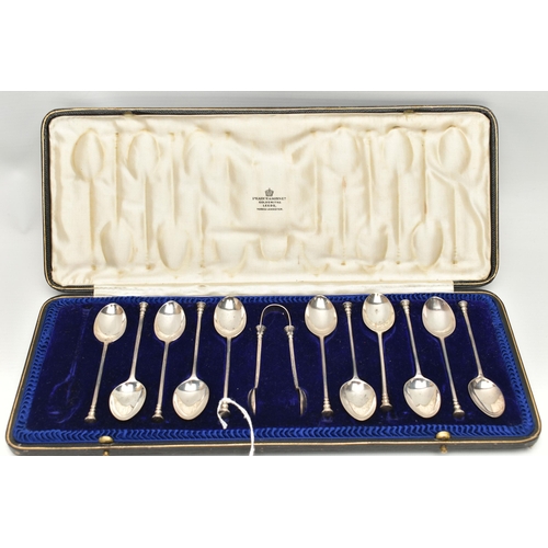 250 - A CASED SET OF ELEVEN GEORGE V SILVER RAT TAIL PATTERN SEAL END TEASPOONS AND MATCHING SUGAR TONGS, ... 