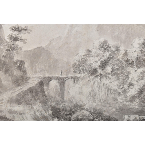 305 - AN EARLY 19TH CENTURY ROMANTIC ENGLISH SCHOOL LANDSCAPE, a solitary figure is crossing a bridge with... 