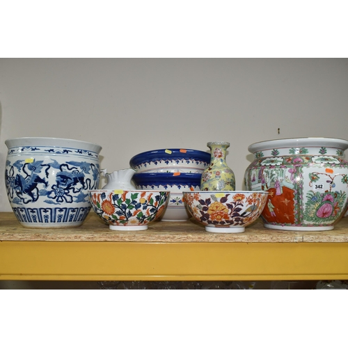 342 - A GROUP OF EIGHT ORIENTAL STYLE PLANTERS AND BOWLS, comprising a large blue and white planter decora... 