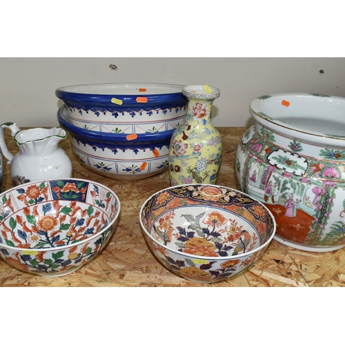 342 - A GROUP OF EIGHT ORIENTAL STYLE PLANTERS AND BOWLS, comprising a large blue and white planter decora... 