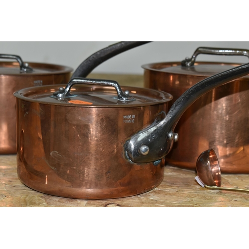 353 - THREE GRADUATING FRENCH COPPER SAUCEPANS, with lids, all stamped 'Made in France', diameters 18cm, 1... 