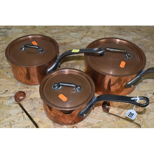 353 - THREE GRADUATING FRENCH COPPER SAUCEPANS, with lids, all stamped 'Made in France', diameters 18cm, 1... 