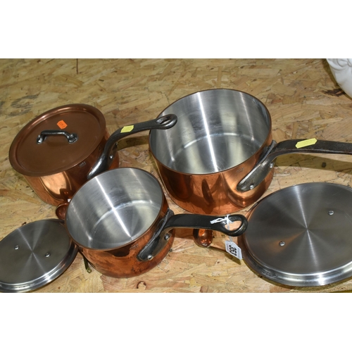 353 - THREE GRADUATING FRENCH COPPER SAUCEPANS, with lids, all stamped 'Made in France', diameters 18cm, 1... 