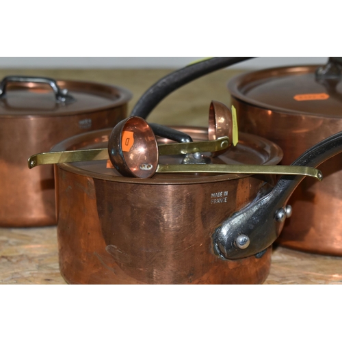 353 - THREE GRADUATING FRENCH COPPER SAUCEPANS, with lids, all stamped 'Made in France', diameters 18cm, 1... 