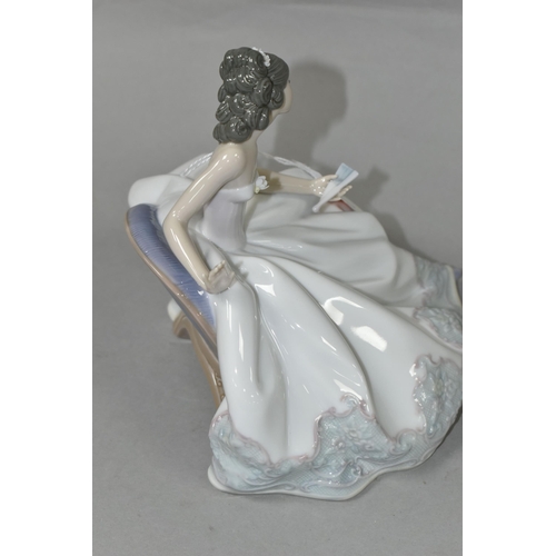 418 - A LLADRO 'AT THE BALL' FIGURINE, no 5859, depicting a seated lady in a ball gown holding a fan, scul... 