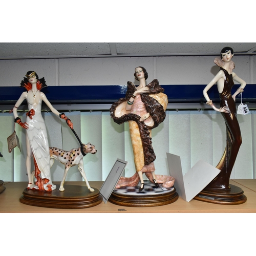 424 - THREE CAPODIMONTE FIGURES BY SANTINI, comprising Leopard Lady, Michelle and Phoebe, each standing on... 