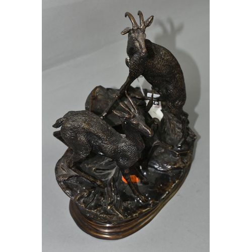 425 - A HOLLOWCAST BRONZE FIGURE GROUP AFTER JULES MOIGNEZ (FRENCH, 1835-1894), depicting a pair of mounta... 