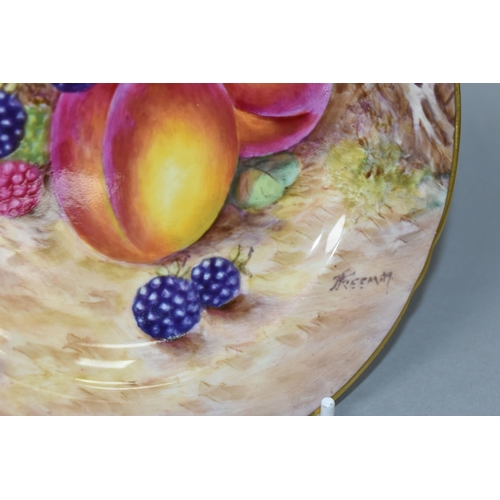 430 - A ROYAL WORCESTER HAND PAINTED FRUIT STUDY SIDE PLATE, signed (John) Freeman, painted with peaches a... 