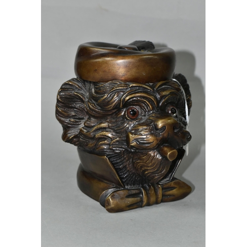 434 - A BRONZE TOBACCO JAR IN THE FORM OF AN ANTHROPOMORPHIC TERRIER, with glass eyes, its hinged cover in... 