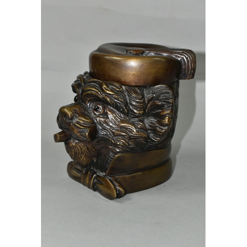 434 - A BRONZE TOBACCO JAR IN THE FORM OF AN ANTHROPOMORPHIC TERRIER, with glass eyes, its hinged cover in... 