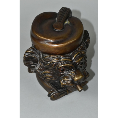 434 - A BRONZE TOBACCO JAR IN THE FORM OF AN ANTHROPOMORPHIC TERRIER, with glass eyes, its hinged cover in... 